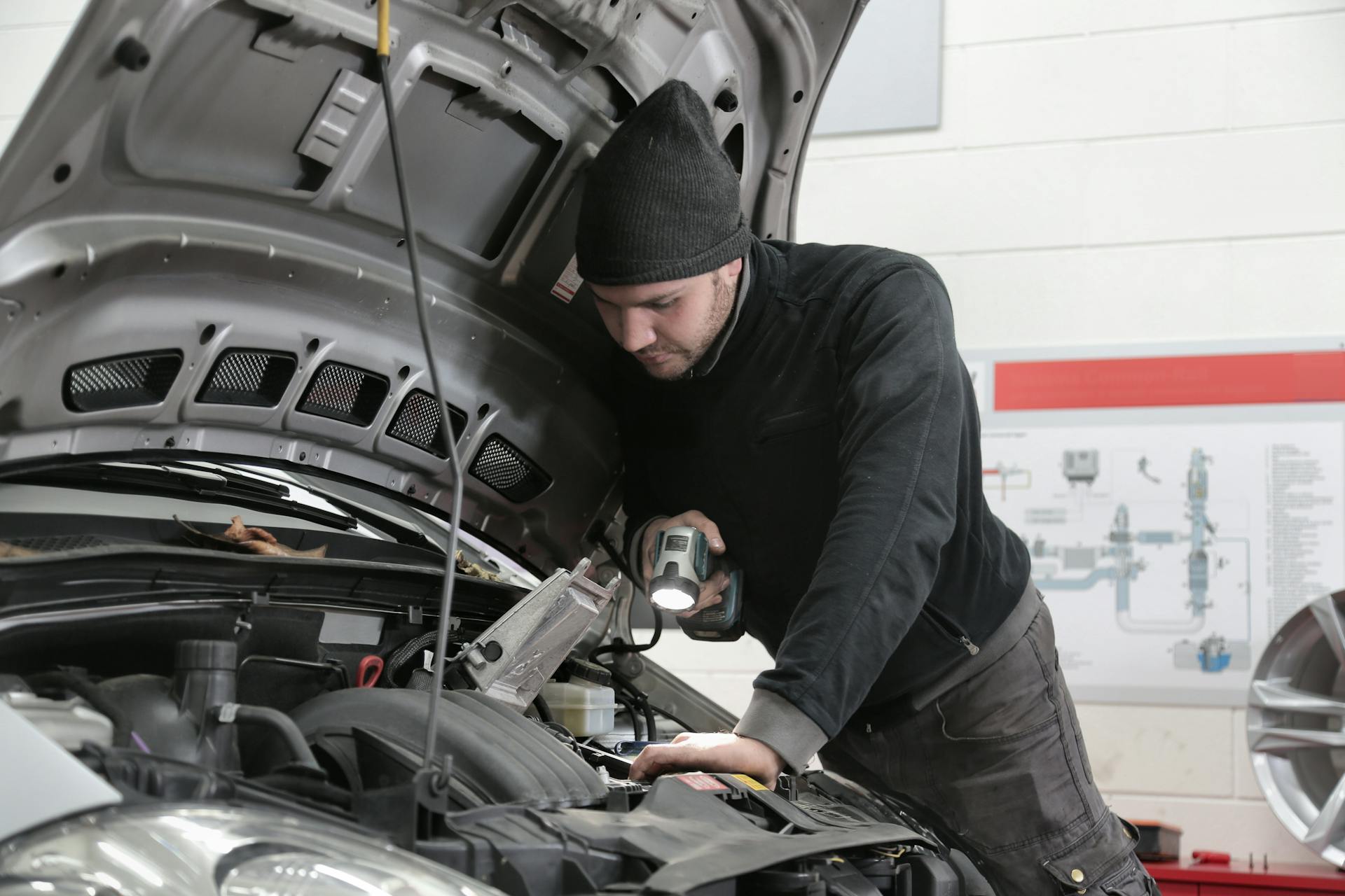 Mechanic performing AC and heating repair service at Pro Automotive Repair in Sachse TX